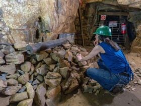 Visitor explores the original 1870s mine shaft of Bald Hill tourist mine, Hill End Historic Site.