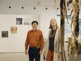Two visitors enjoy the Disruptor exhibition