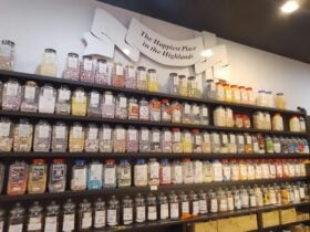 Traditional sweet shop jarwall with happiest place in Higlands sign