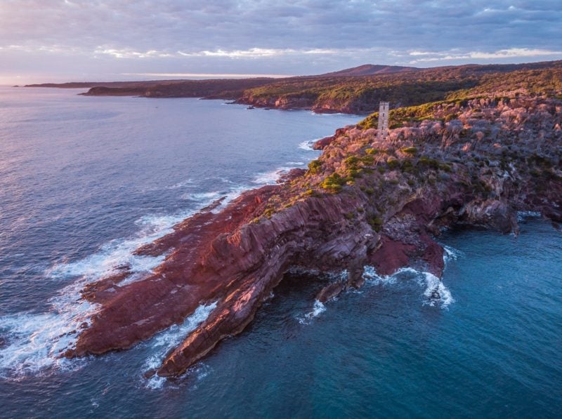 Sun rising over Boyd Tower on Red Point in the Ben Boyd National Park, Edrom