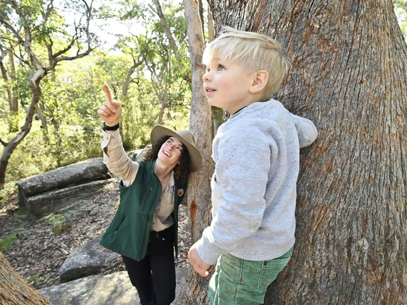 An NPWS ranger shows a child who
