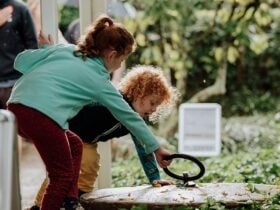 Two children in the gardens at the Homestead