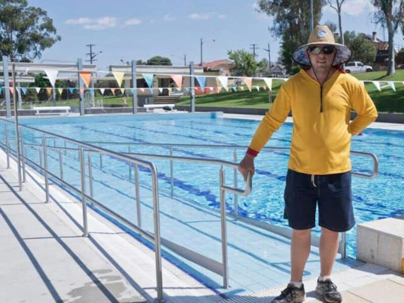 Wheelchair ramp into pool with lifeguard