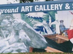 Mural on front of the building, in street-art style, showing arty features