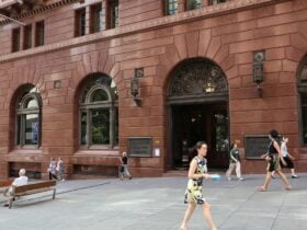 A large brick building on a busy city street
