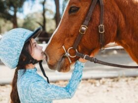 Girl and horse having a moment.