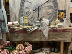 French gifts and homewares to decorate your home - large clock on a console displayed with linen