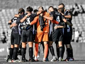 macarthur fc players in a huddle