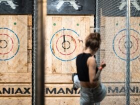 Woman throwing an axe at a target