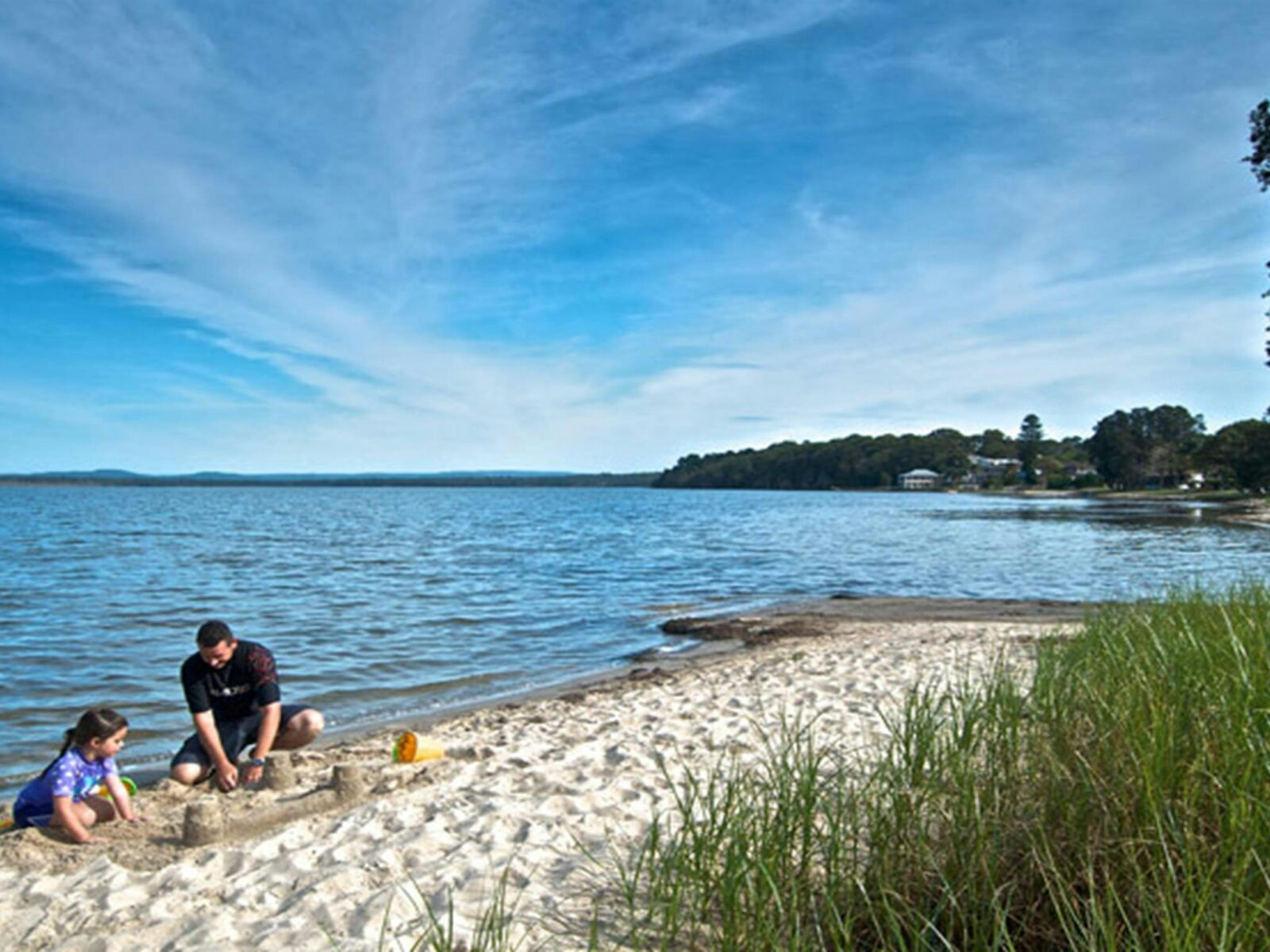 Family playing on the river bank, Elizabeth Bay. Photo: John Spencer © DPIE