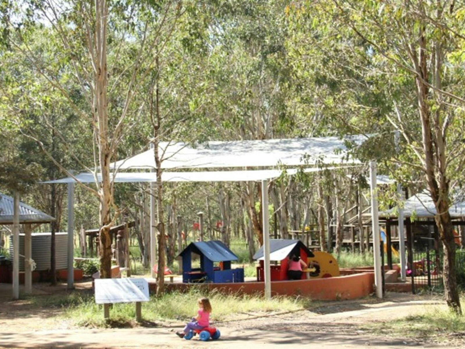 Family picnic and adventure playground area overlooking a toddlers