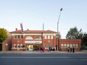 Red brick ambulance station building photographed from street view, now operating as an art gallery.