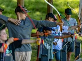 Young people learning archery