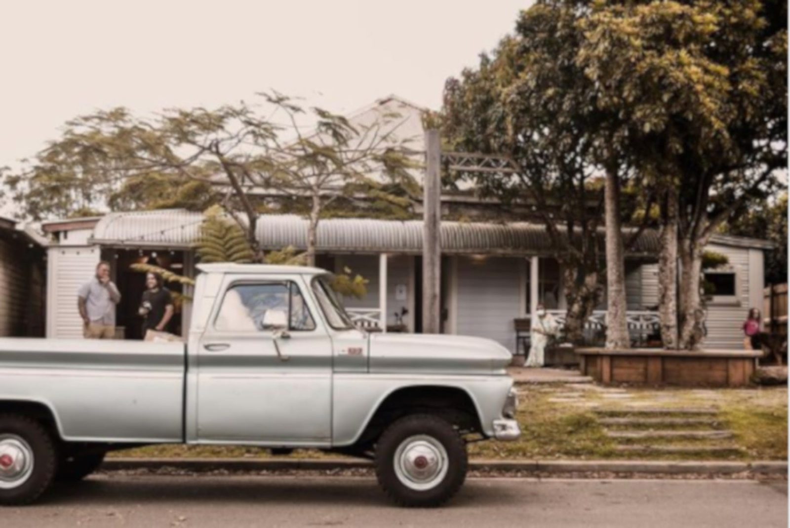 Picture of the shop front with old ute in foreground