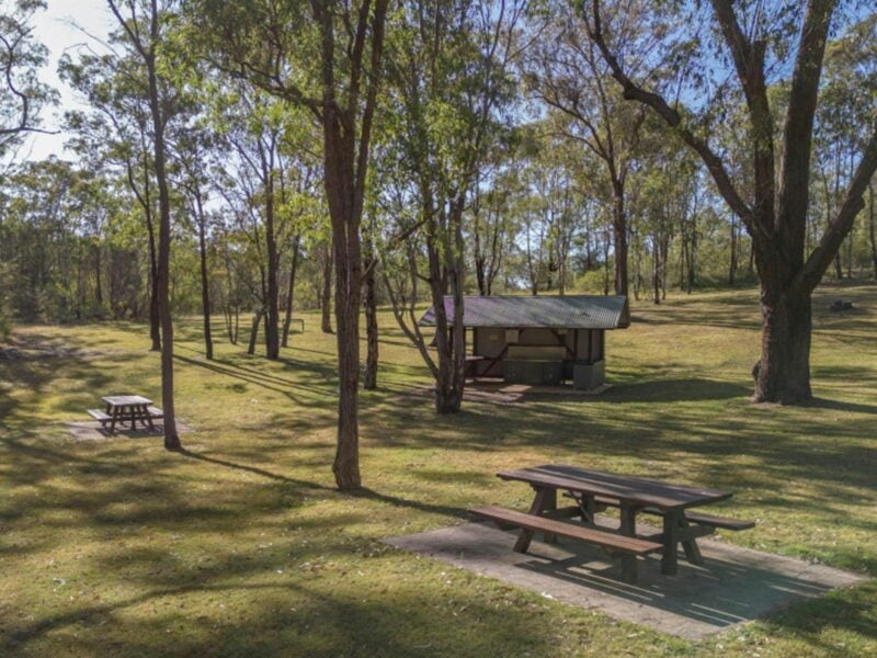 Picnic tables and barbecue facilities at Washpools picnic area. Credit: John Spencer © DPE