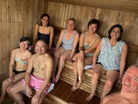 Smiling people in a sauna