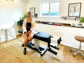 Dr Karli sitting on massage table