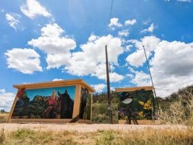 Mural on signal box in Wingen. Depicts horse on rider with wildlife and landscape