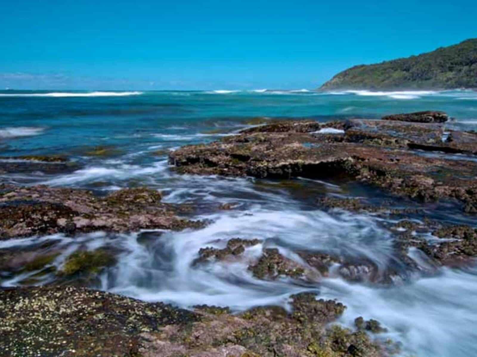 Rocks and water in Bateau Bay, Wyrrabalong National Park. Photo: John Spencer/OEH