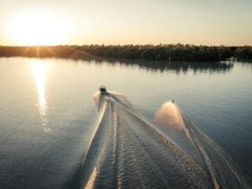 Boat and water skier on lake
