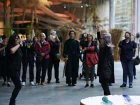 Artists Sue Jo Wright and Angie Goto gesturing our gestural art tour attendees