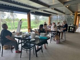 Workshop in action with people painting