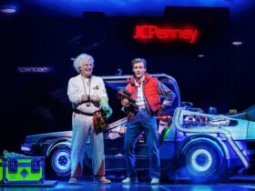 Marty McFly and Doc Brown in front of the Delorean time machine.