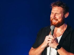 Ben Knight holding a microphone