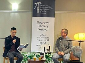 Main stage of Boorowa Literary Festival with a previous author speaking and festival host listening.