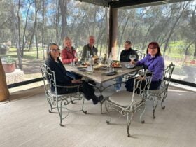 Group of guests working on their totem