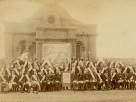 sepia photograph showing the Protestant Hall Queanbeyan with Perservance Members and Banner c.1882