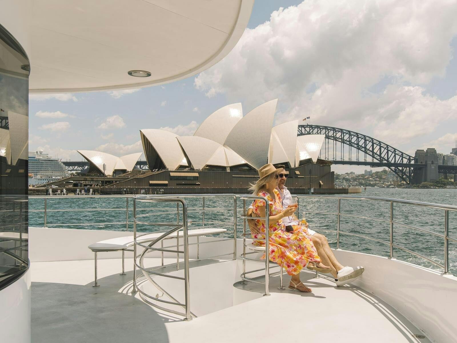 Couple on a Journey Beyond Cruise on one of the decks looking at the harbour