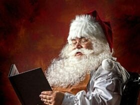 photo of santa reading a book