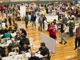 High angle shot of Dungeons and Dragons tables panning out to trading tables