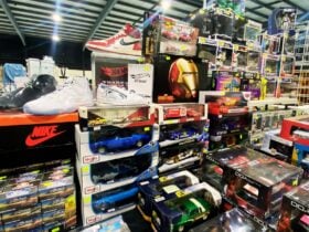 Mixed collectables on display including sneakers, cards and action figures