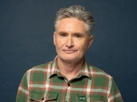 Man, plaid shirt, blue background