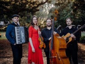 Members of Estampa holding instruments