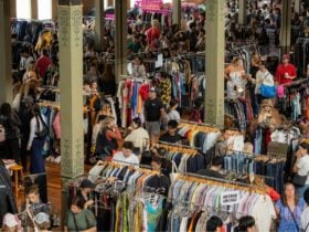 Pictured is a birds eye view of one of our markets, lots of people and clothing.