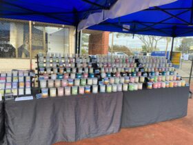 Market stall with a variety of scented candles.