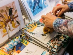 Person looking at goods featuring illustrations of Australian animals.