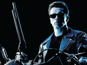 image of The Terminator 2 cover, a man with dark glasses and a long shotgun on a motorbike