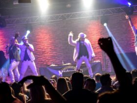 Images of singers on stage dancing