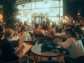 People sitting at tables drawing