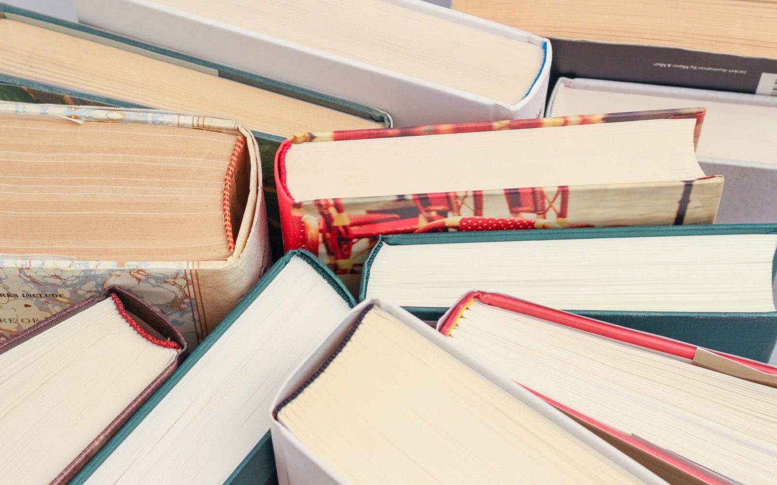 Boks standing up right on the table so you can see the bottom of each book