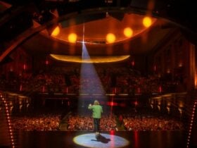 A man on stage in front of an audience