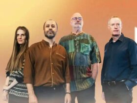 Four people on the orange background