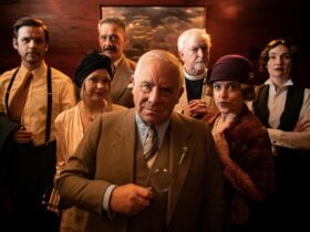group of people dressed in various 1920s character costumes