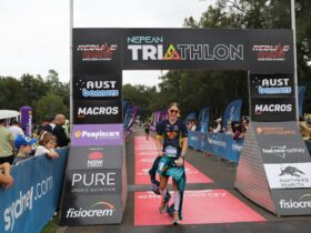 athlete crossing finish line