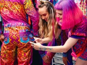 Nixi Killick and model reading Killickâs Cryptic Frequency Augmented Reality Activated clothing