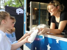People buying food at food van